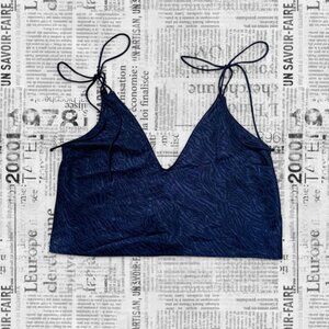 Navy blue zebra print crop top with v-neckline and adjustable tie straps